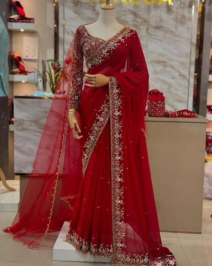 A beautiful red bridal saree , offering the best bridal rental saree —perfect for brides who desire elegance, tradition, and luxury.